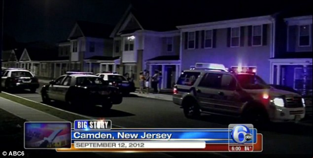 response police cars gather around the house where the rape and murder took place